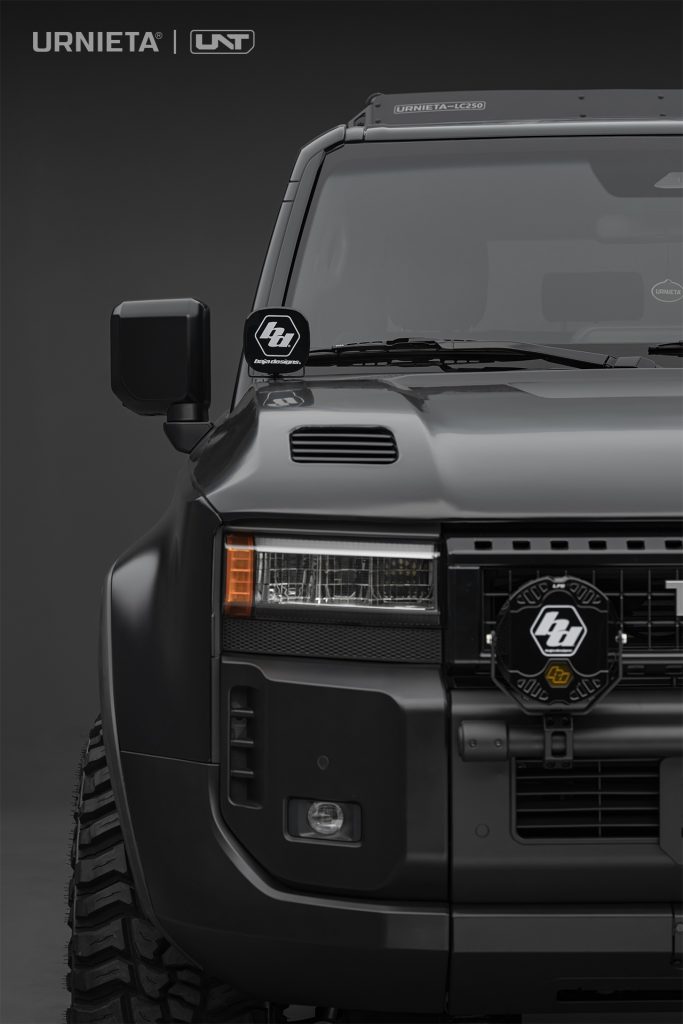 URNIETA LC250 A-Pillar Lighting Brackets on a Toyota Land Cruiser 250, studio front corner view with square lights on the A-pillar and bumper
