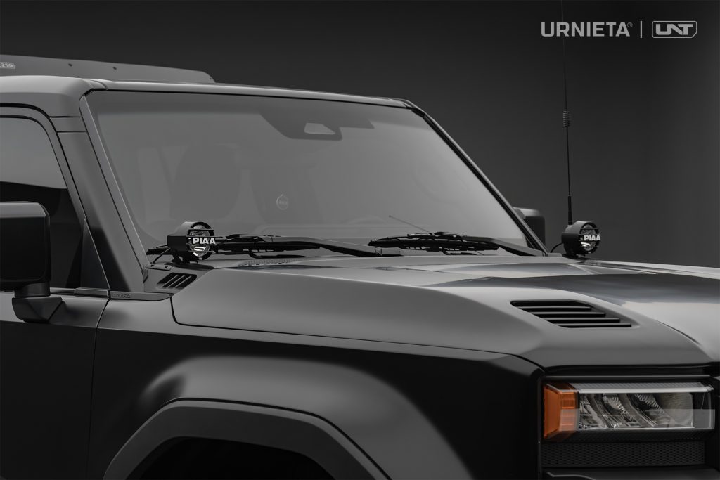 URNIETA LC250 A-Pillar Lighting Brackets on a Toyota Land Cruiser 250, studio front three-quarter view showing both A-pillar lights and antenna